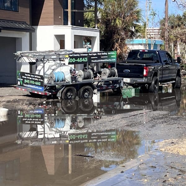 SWS Truck and trailer on hurricane debris road